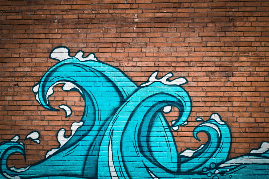 Wave Graffiti on a Brick Wall